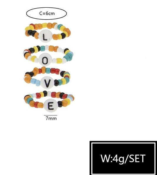A set of 4 LOVE Letters Memory Wire Colourful Bead Stretch Rings Beaded Ring UK